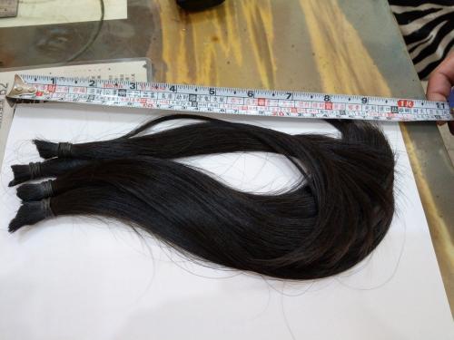 小学生剪下头发捐赠。台湾《联合报》记者林家琛摄影 小学生剪下头发捐赠。台湾《联合报》记者林家琛摄影